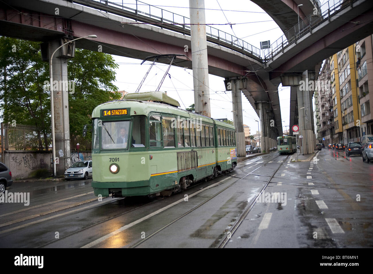 Via Prenestina with a trolley car underneath highway Tangenziale Est in Rome Italy Stock Photo