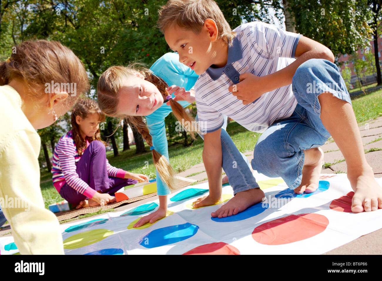 Portrait of happy friends playing outdoor game Stock Photo - Alamy