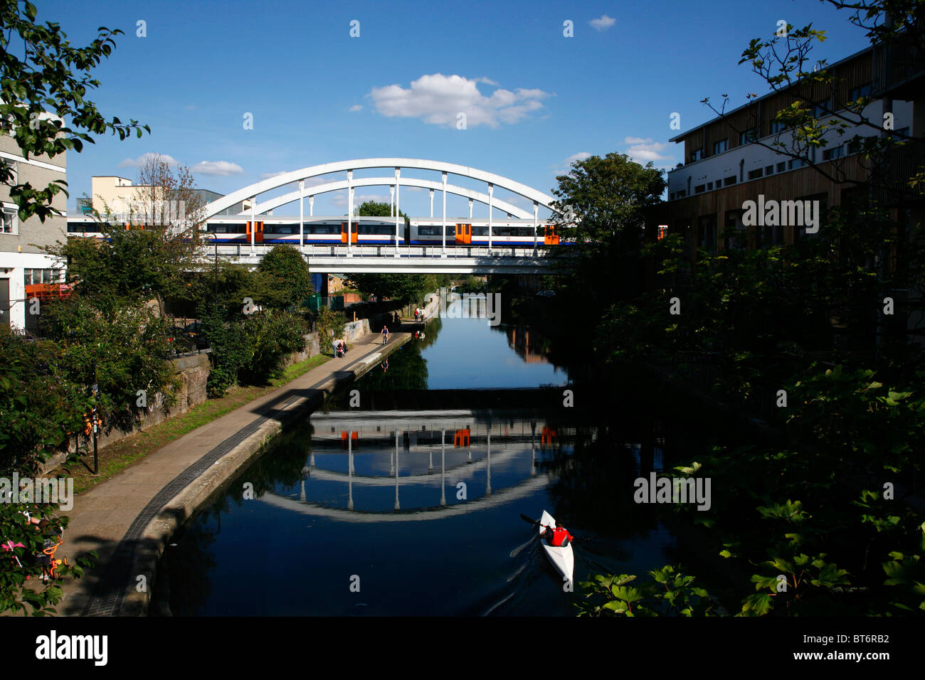 East London line (Overground) train crossing the Regent's Canal at Haggerston, London, UK Stock Photo