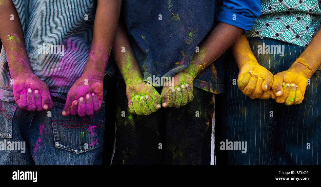 Indian boys multicoloured powdered hands Stock Photo