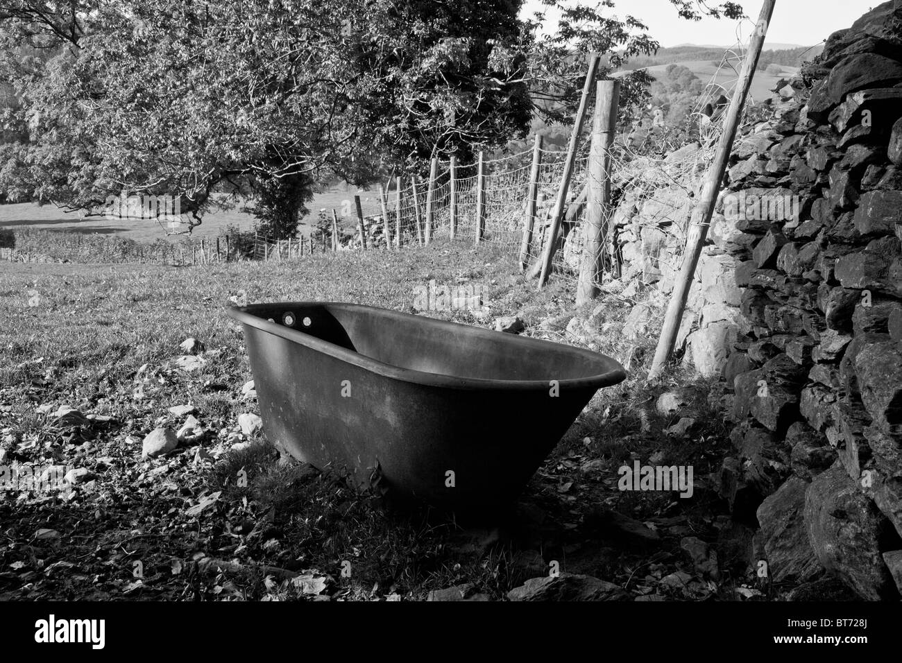 Metal tub in Cumbrian field near Hawkshead, Lake District, Cumbria Stock Photo
