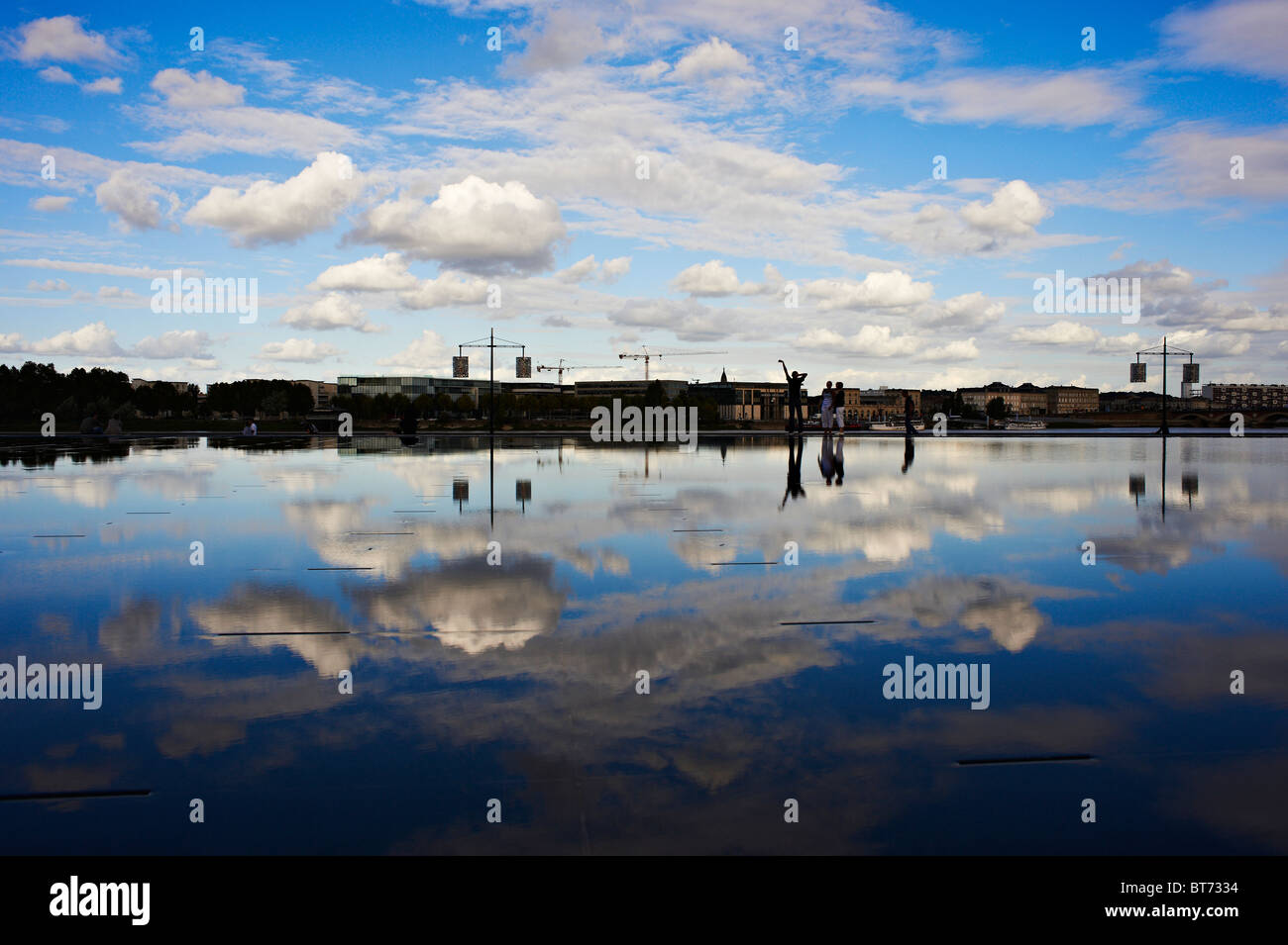 Beautiful blue sky and cloud reflected perfectly from a pool of still water in Bordeaux city centre, France Stock Photo