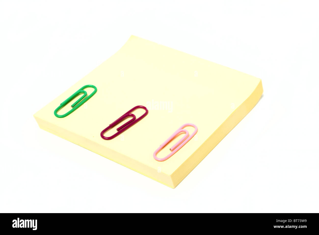 Stapled Note Notes and staples isolated on white background Stock Photo - Alamy