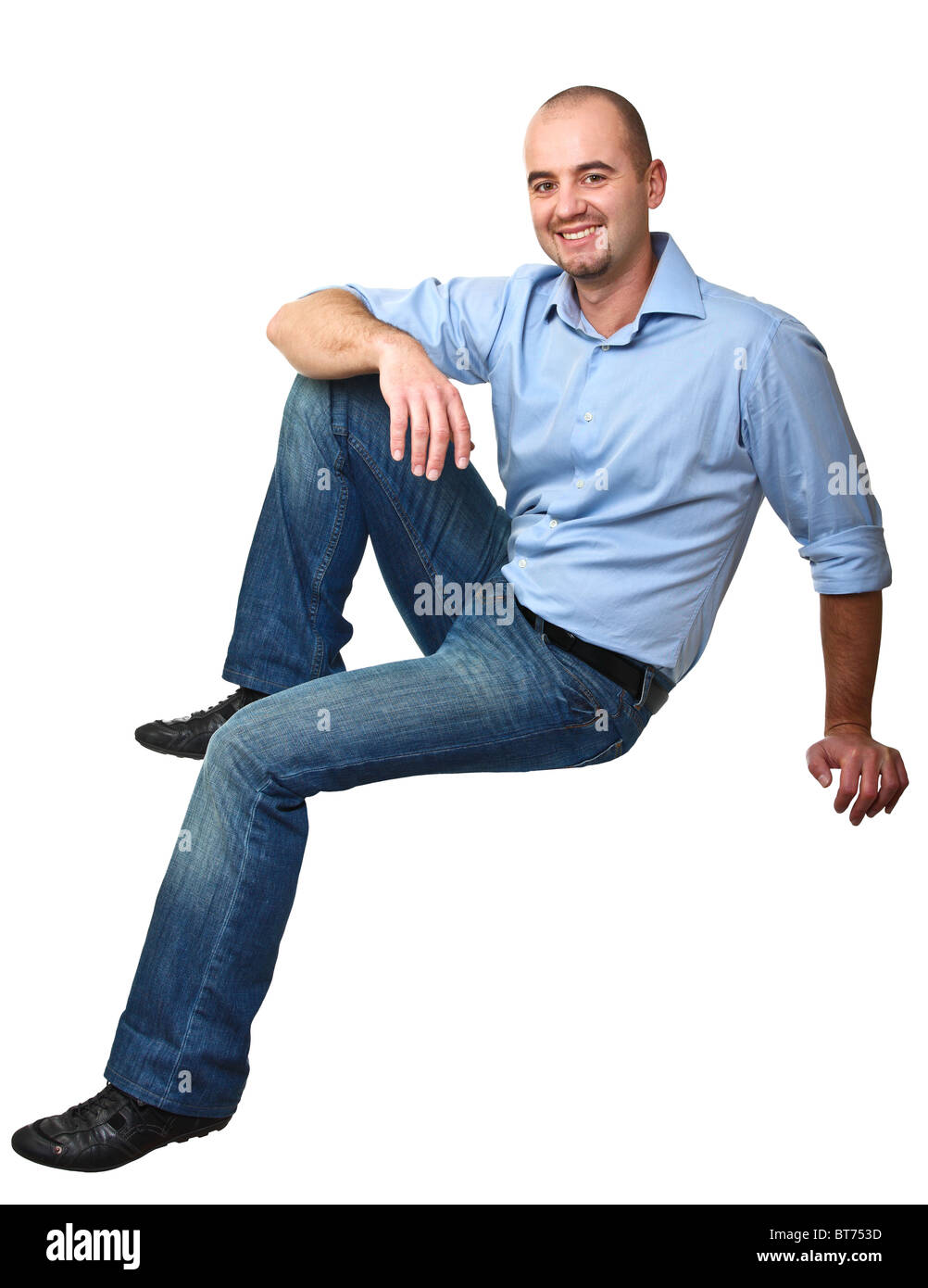 sit young caucasian man isolated on white background Stock Photo