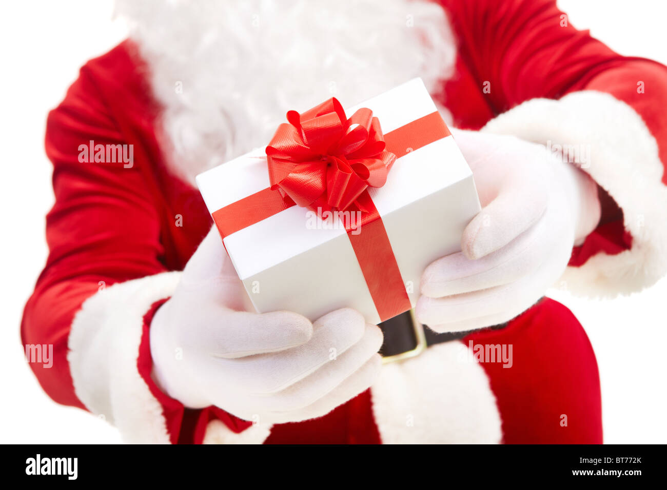 Photo of Santa Claus hands holding giftbox with red bow Stock Photo - Alamy