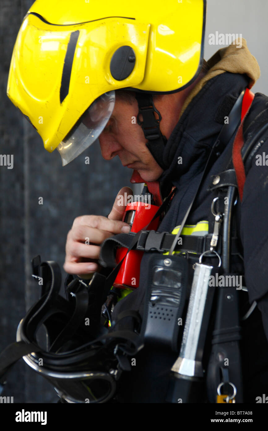 Fire fighter testing radio Stock Photo