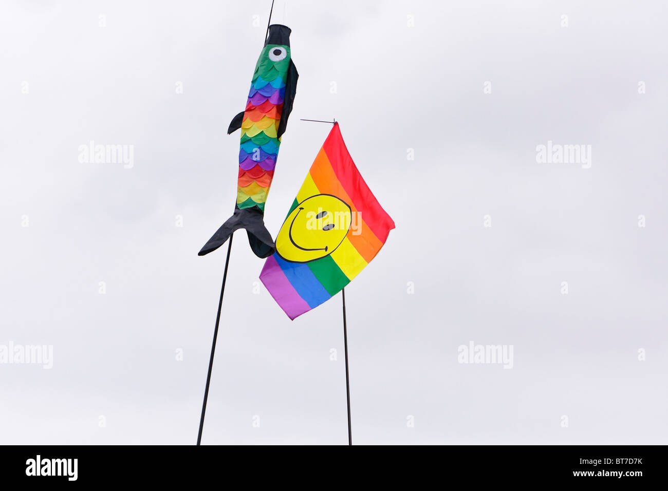 Colourful rainbow flags of a fish and smiley face at Hertfordshire Game Fair 2010 Stock Photo