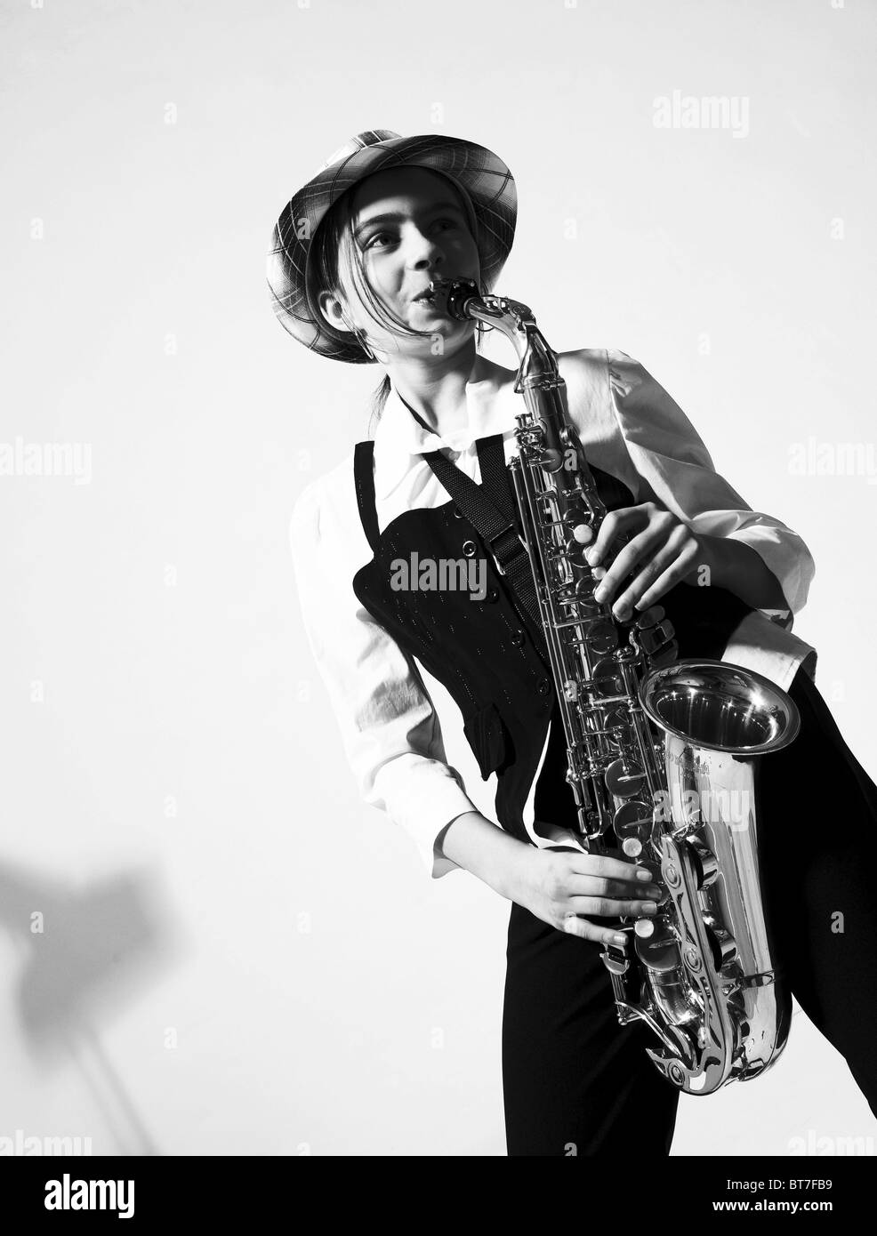 Girl playing the saxophone Stock Photo