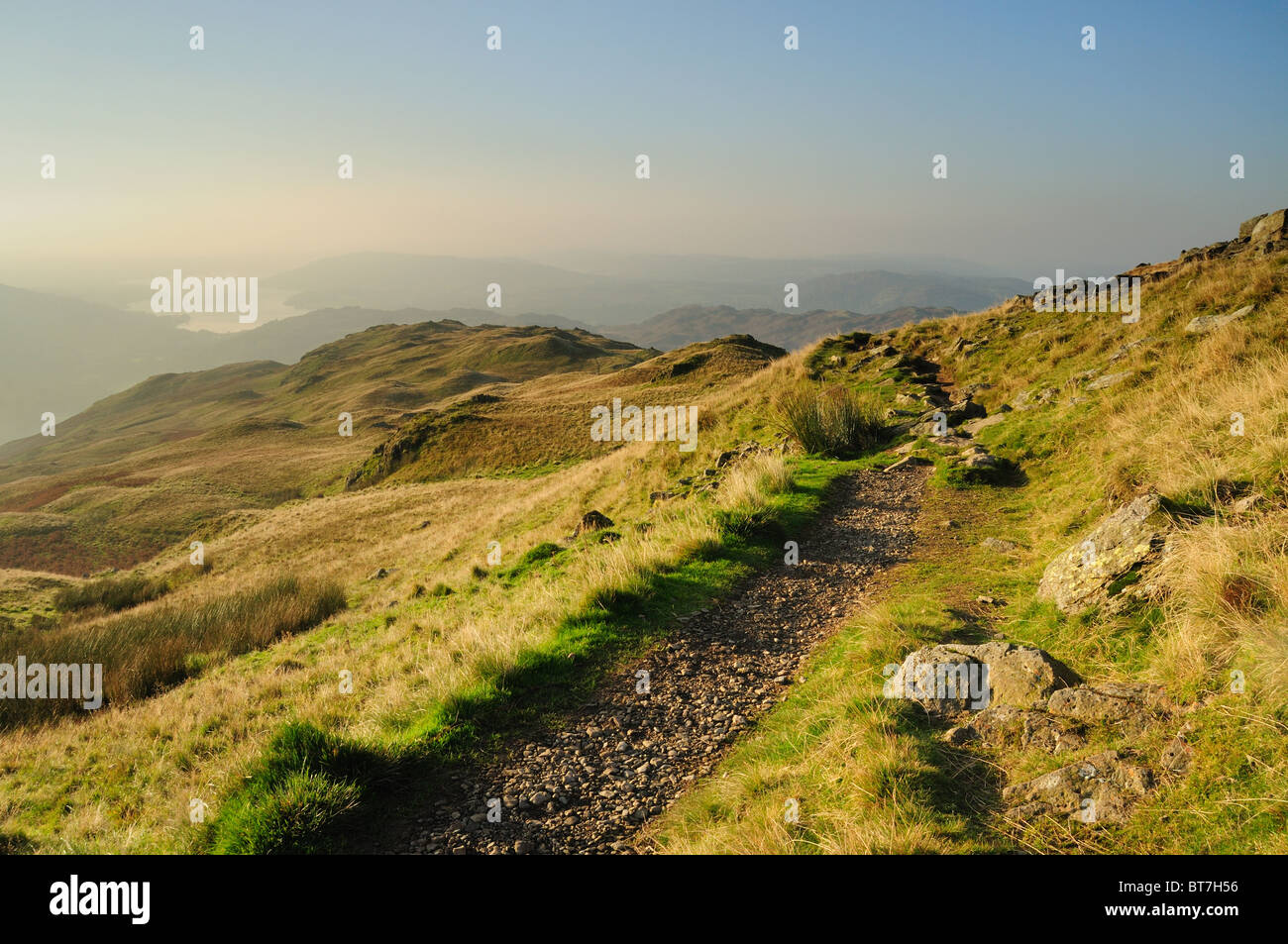 Footpath on Heron Pike with Lake Windermere in the distance, English Lake District Stock Photo