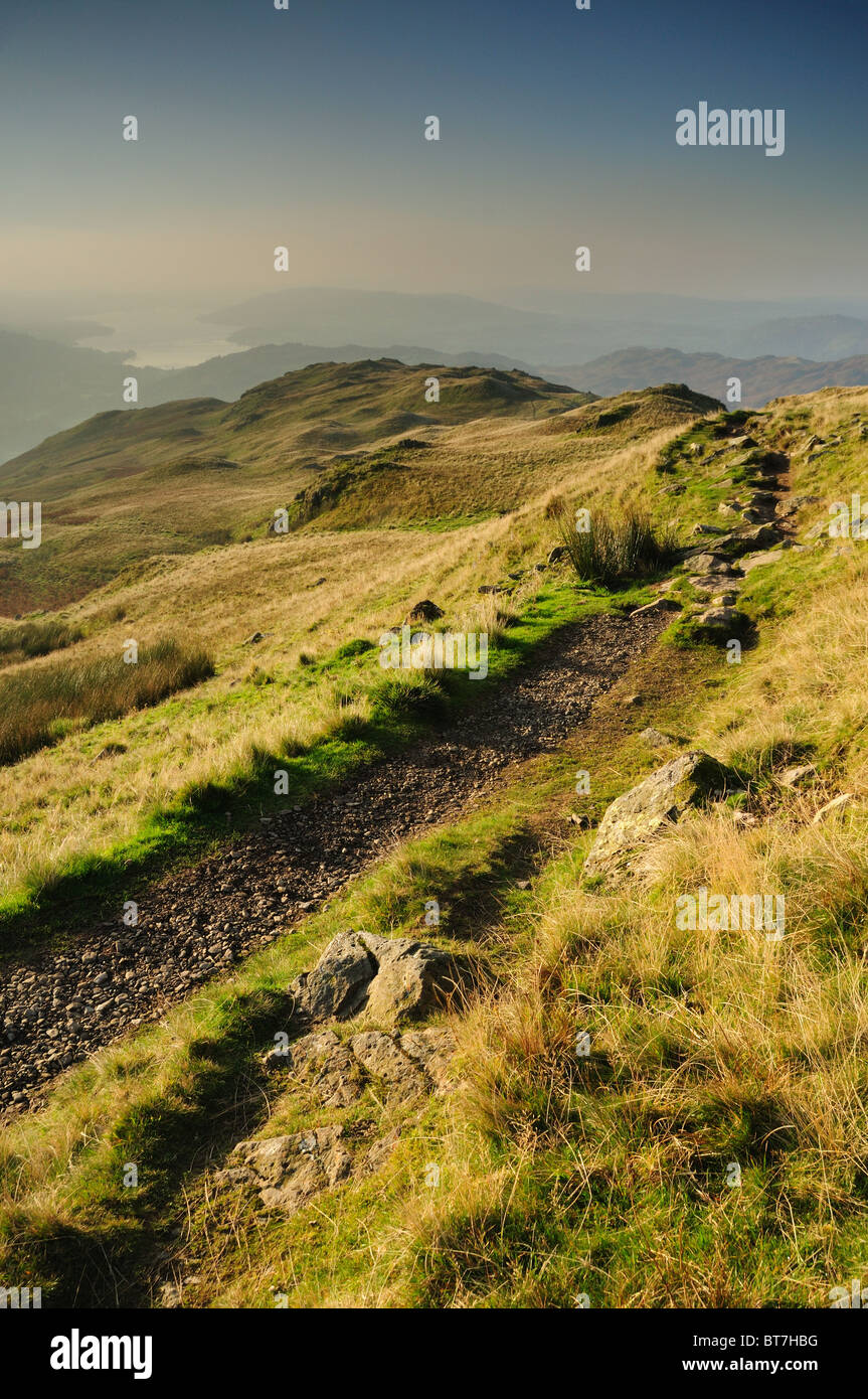 Footpath on Heron Pike with Lake Windermere in the distance, English Lake District Stock Photo