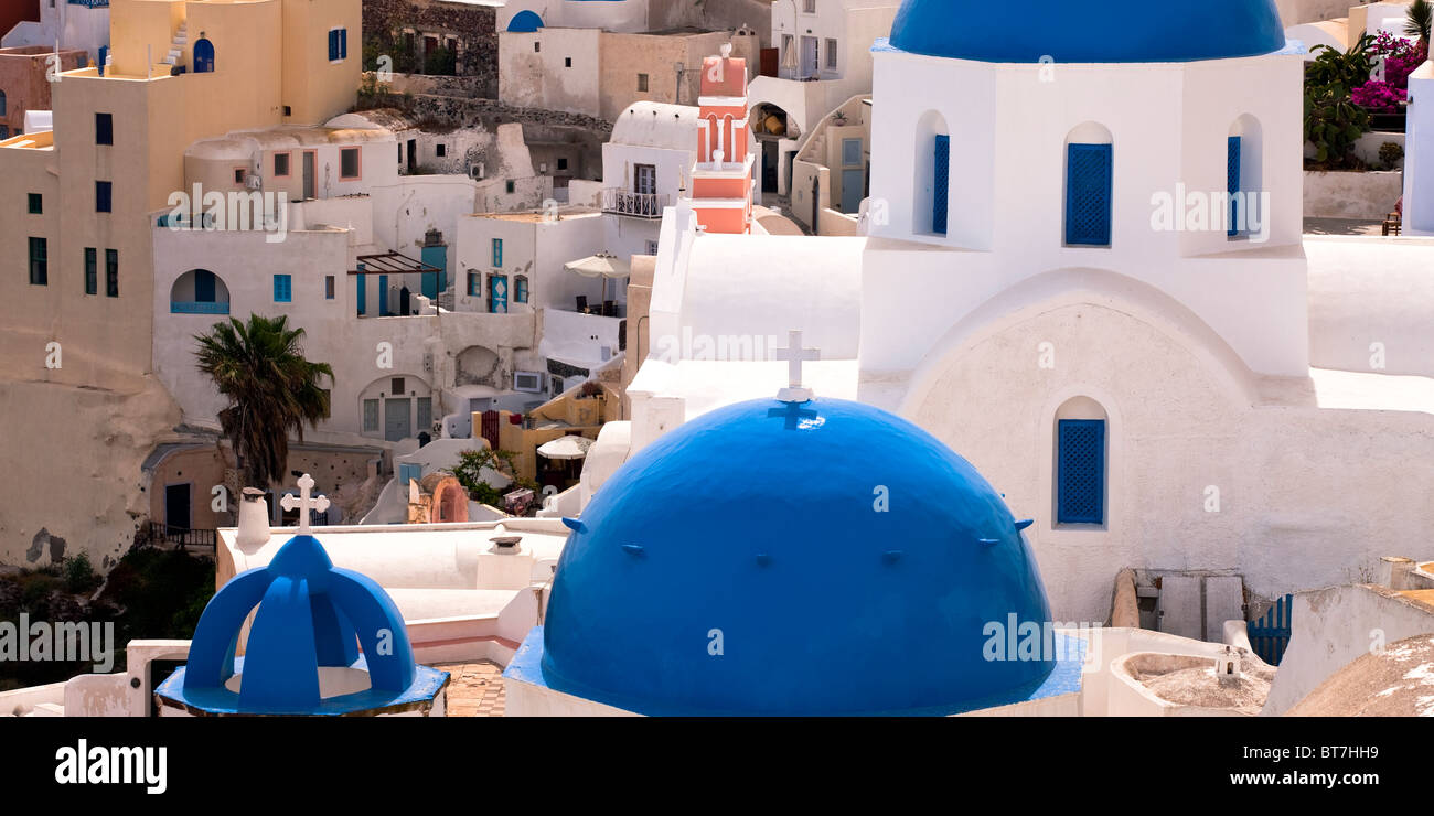 Typical architecture with Church Domes and Bell Tower Oia Santorini Cyclades Islands Greece Stock Photo