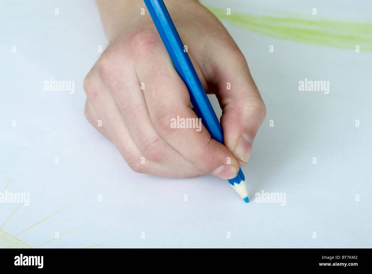Hand holding a color dark blue pencil Stock Photo - Alamy