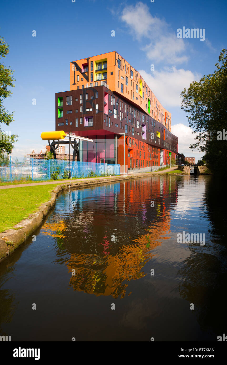 The Chips apartment building, designed by Will Alsop, beside the Ashton Canal, New Islington district, Manchester, UK Stock Photo