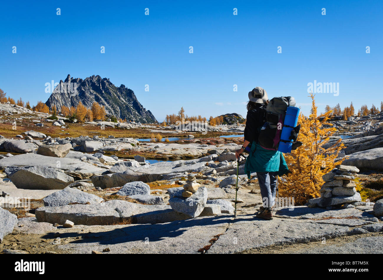 Backpacker hiking in the Upper Enchantments, Alpine Lakes Wilderness, Washington. Stock Photo