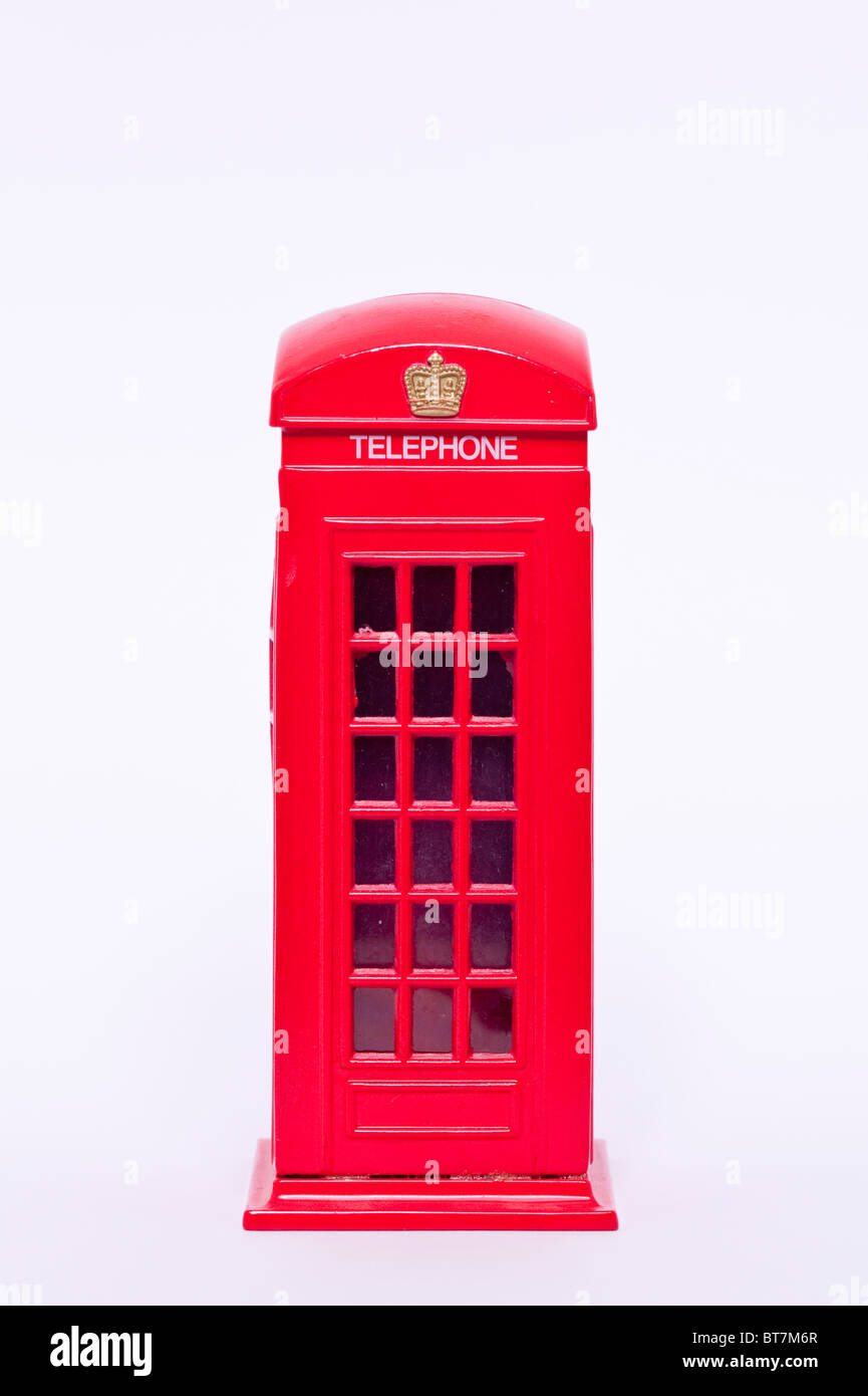 A close up photo of a model red old style telephone phone box against a