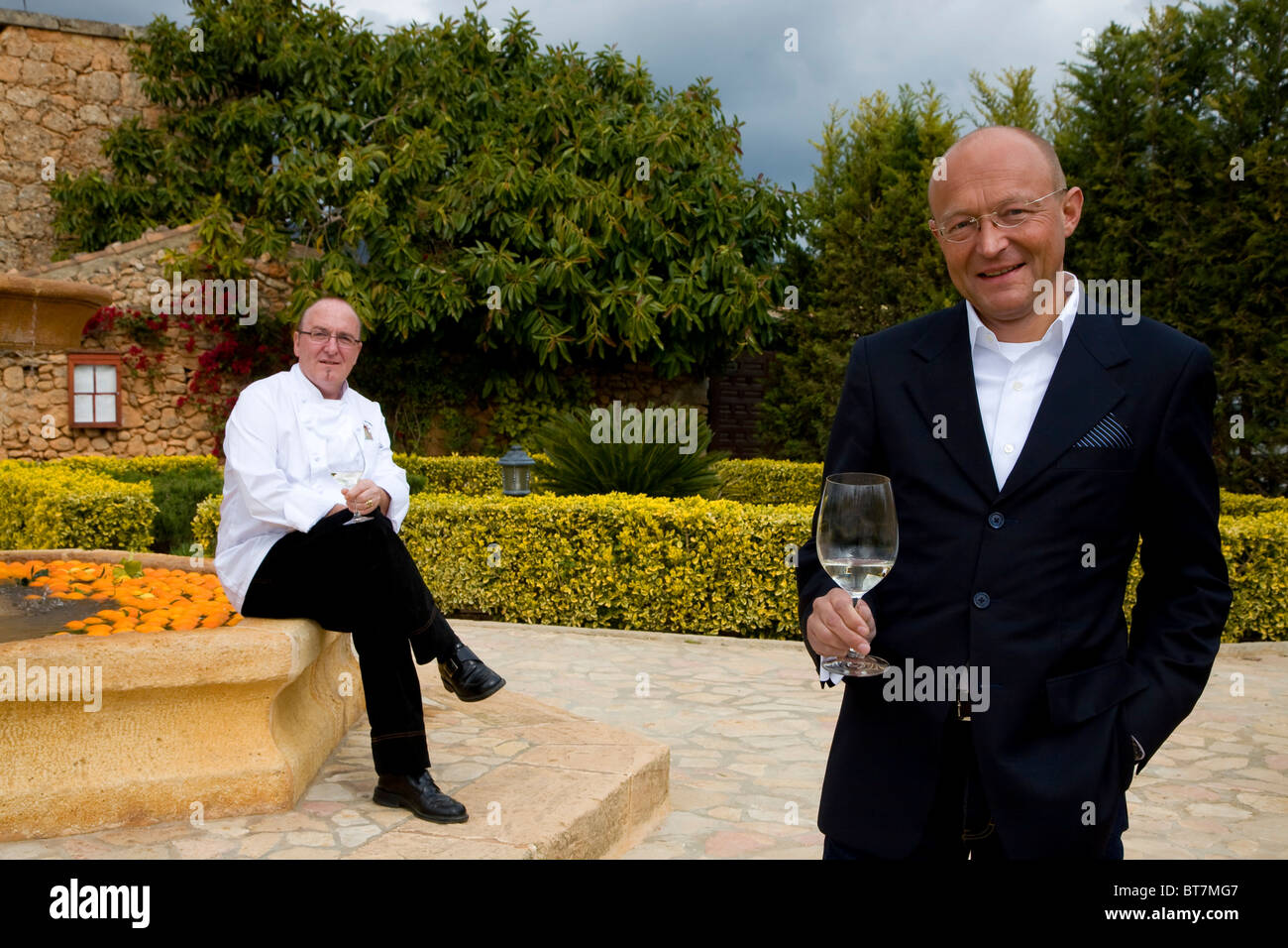 Winemaker Prof. Michael Popp, right, Peter Himbert, head chef of the Molí des Torrent restaurant, Santa María del Camí, Majorca Stock Photo