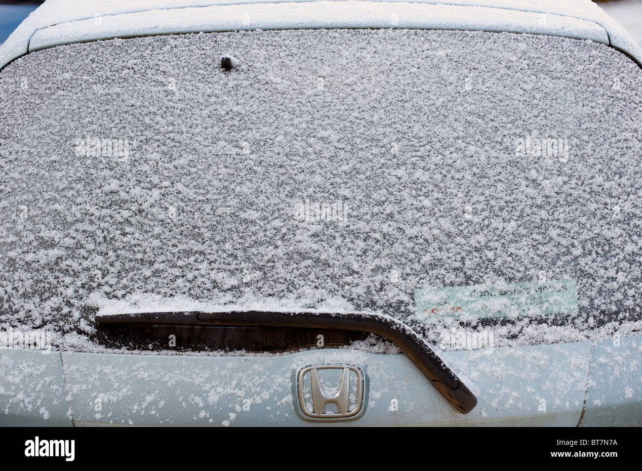 Iced up rear window screen on a Honda Jazz car Stock Photo