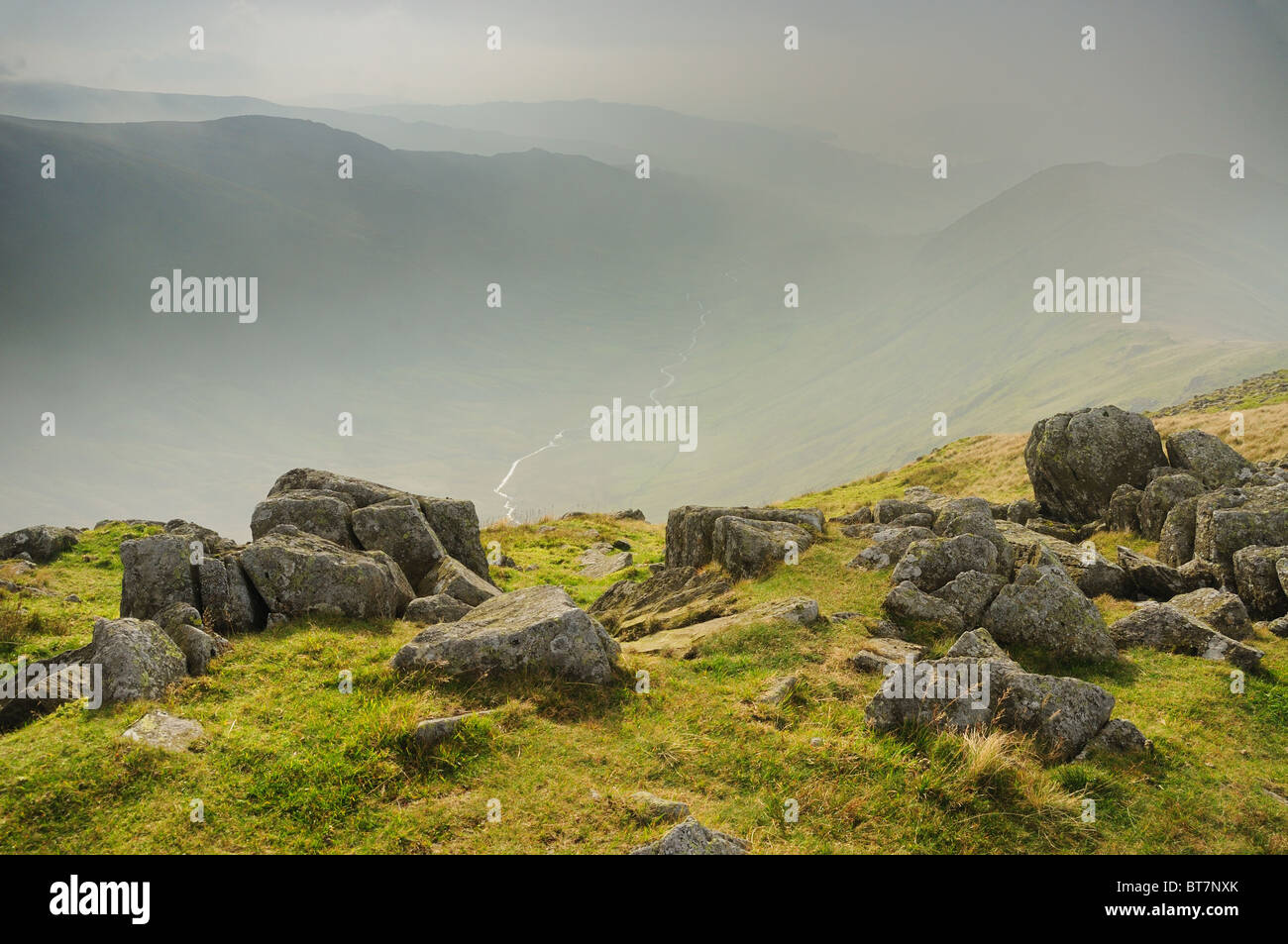 View down a misty Rydal Valley from Great Rigg in the English Lake District Stock Photo