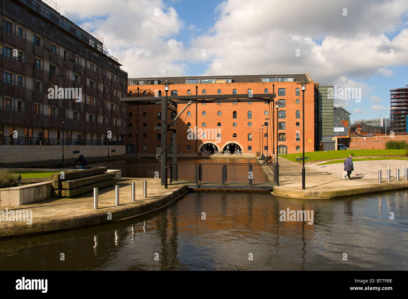 Old warehouses converted to modern apartments at Piccadilly Basin on the Rochdale Canal, near Manchester city centre, England UK Stock Photo