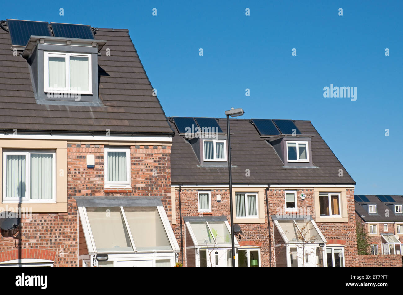 Solar panels on the roofs of new properties in Oldham,Greater