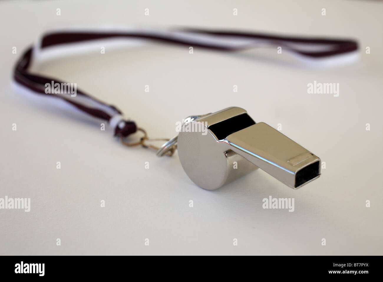 Silver whistle on white background Stock Photo
