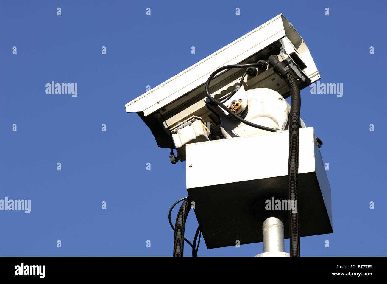 CCTV camera against blue sky Stock Photo - Alamy