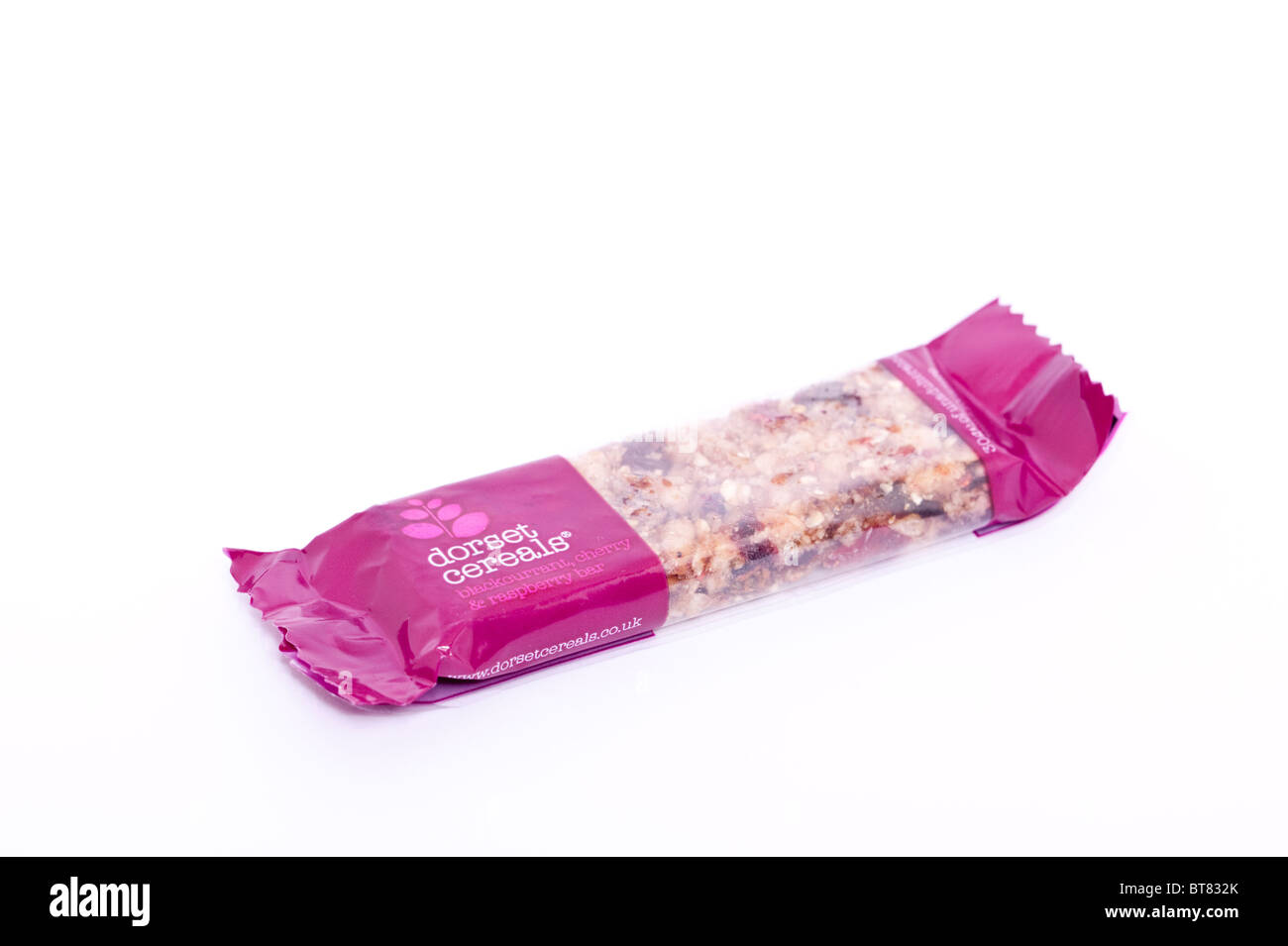 A close up photo of a dorset cereals muesli cereal bar against a white background Stock Photo