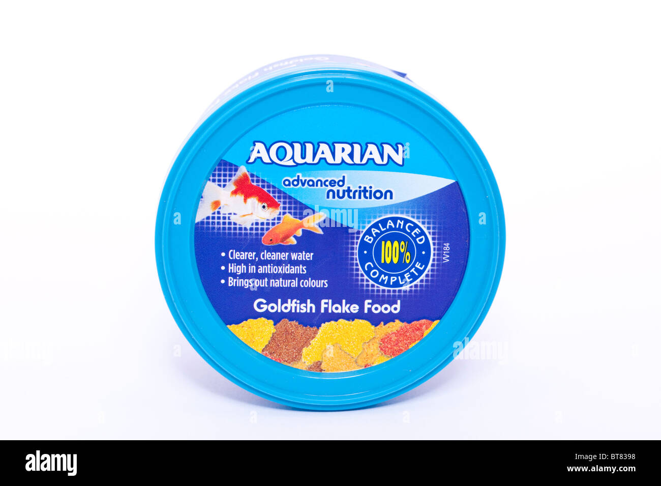 A close up photo of a tub of Aquarian goldfish flake food against a white background Stock Photo