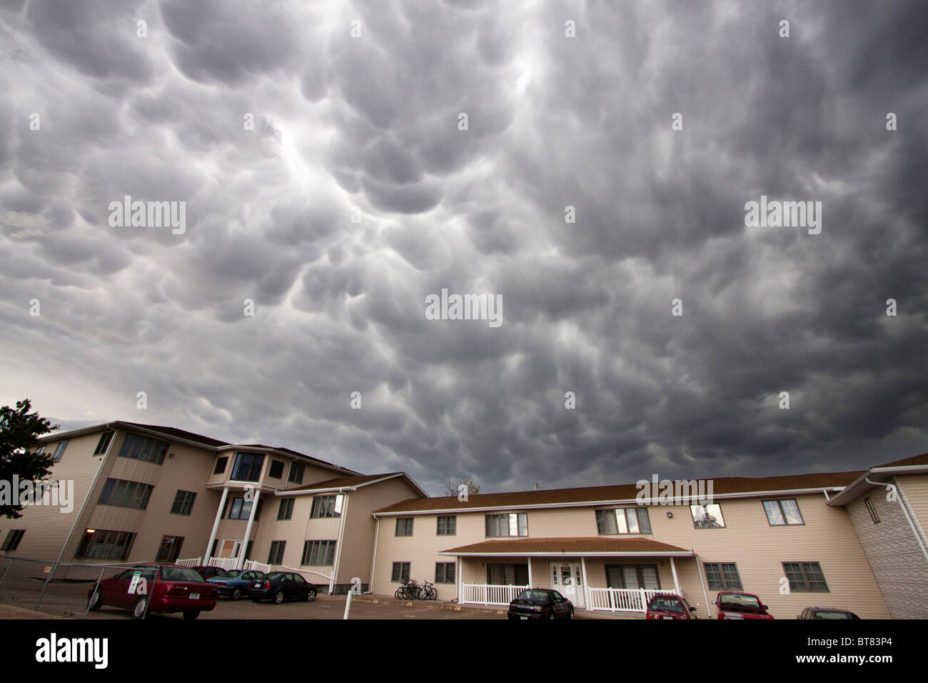 Mammatus clouds roll overhead an apartment complex in Kearney, Nebraska, June 7, 2010. Stock Photo