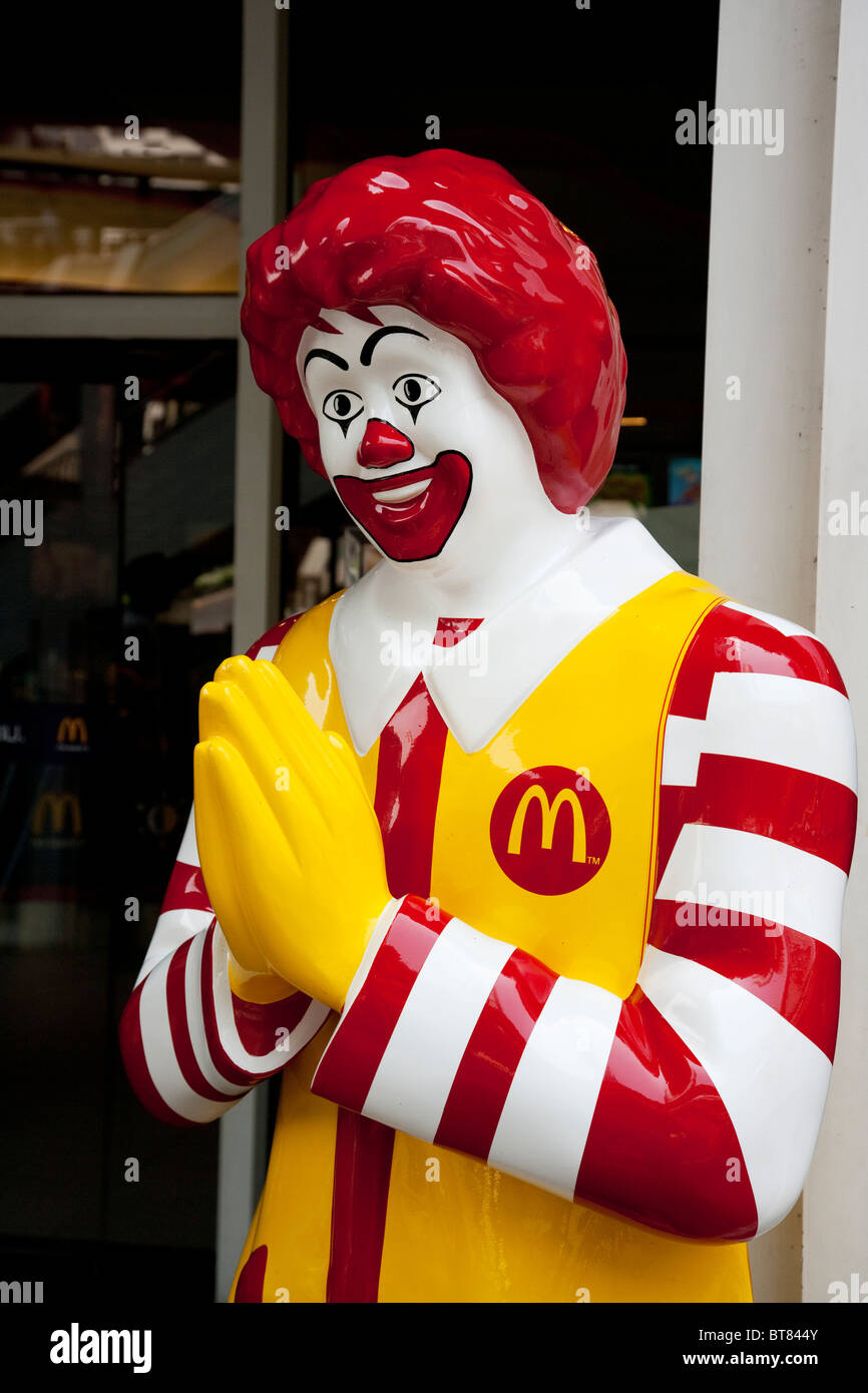 The Ronald McDonald statue outside the fast food restaurant in Bangkok Thailand Stock Photo