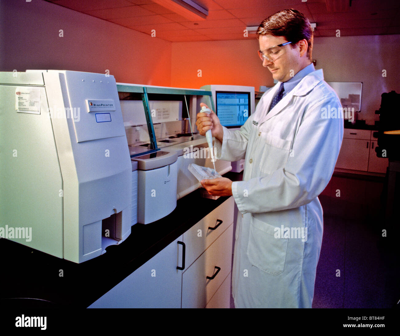 Scientific workers  modern lab analysis equipment Stock Photo