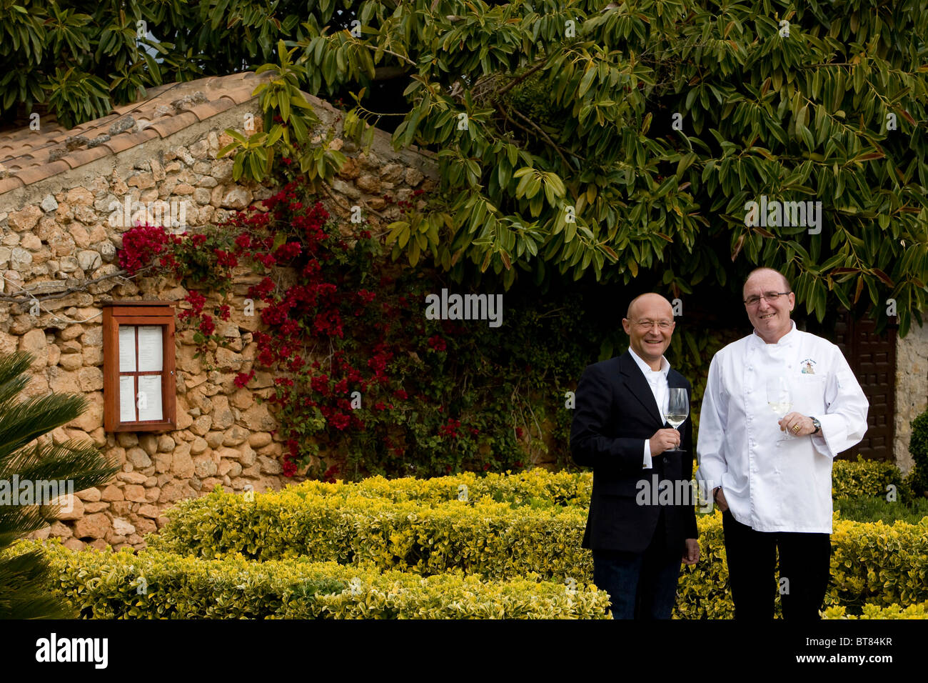 Winemaker Prof. Michael Popp, left, Peter Himbert, head chef of the Molí des Torrent restaurant, Santa María del Camí, Majorca Stock Photo