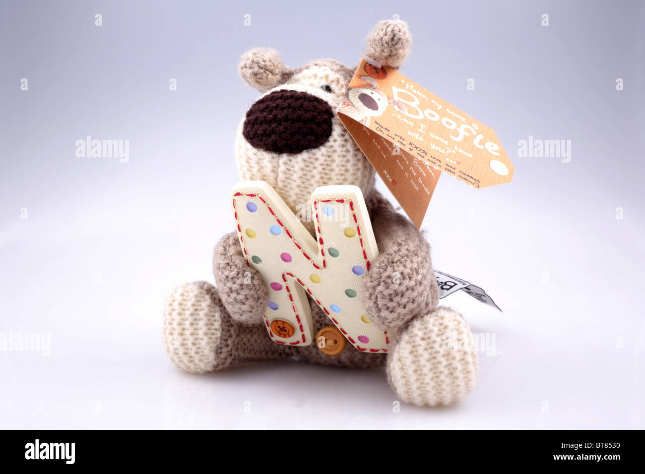 Stuffed toy bear of character Boofle holding the letter 'N'. Stock Photo