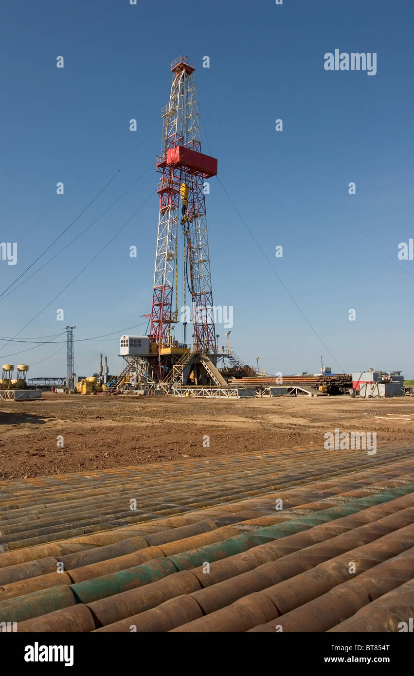 Ug Rig Onshore oil and gas exploration site. Pipes in compound before being ...