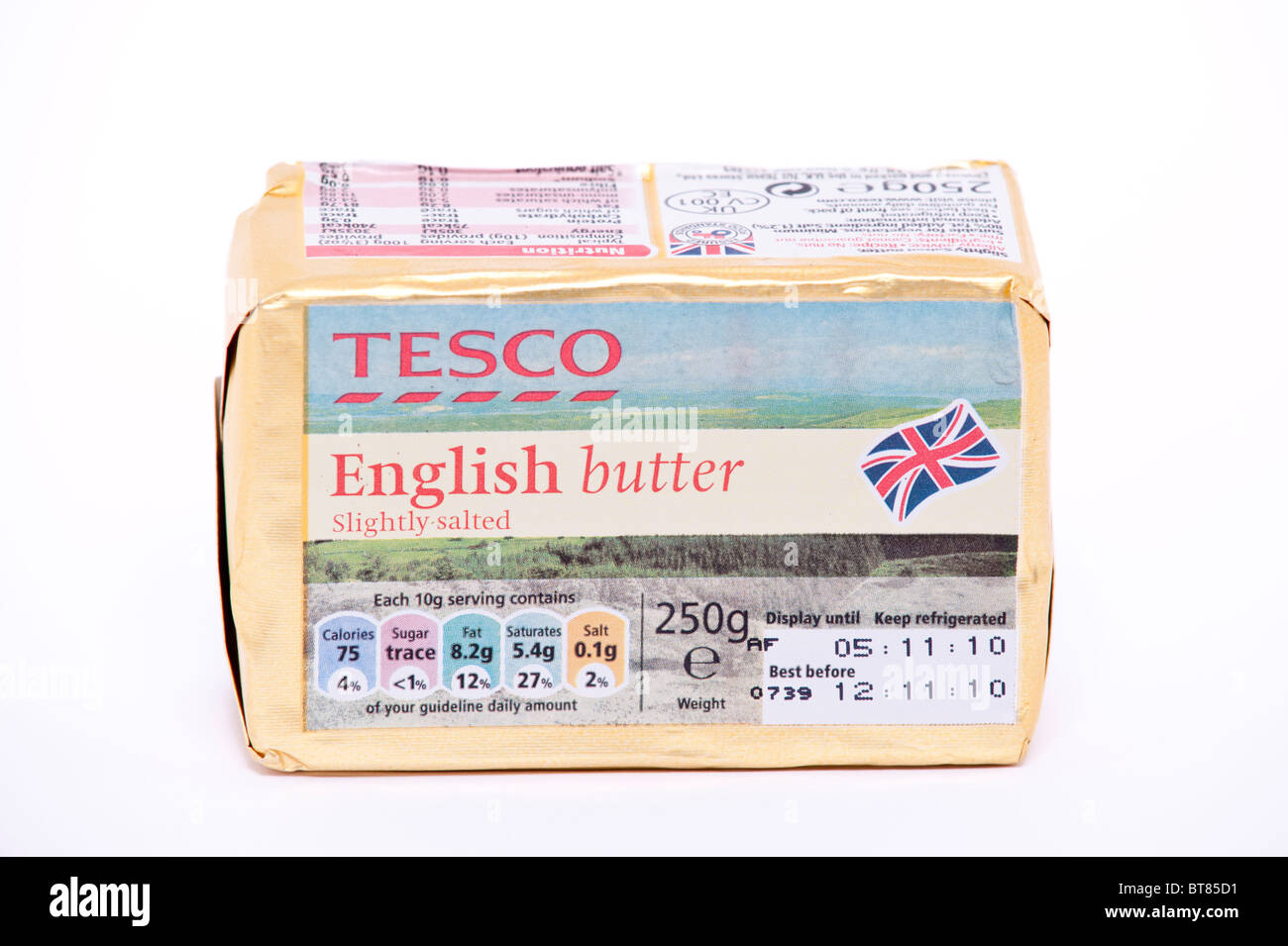 A close up photo of a block of Tesco English butter against a white