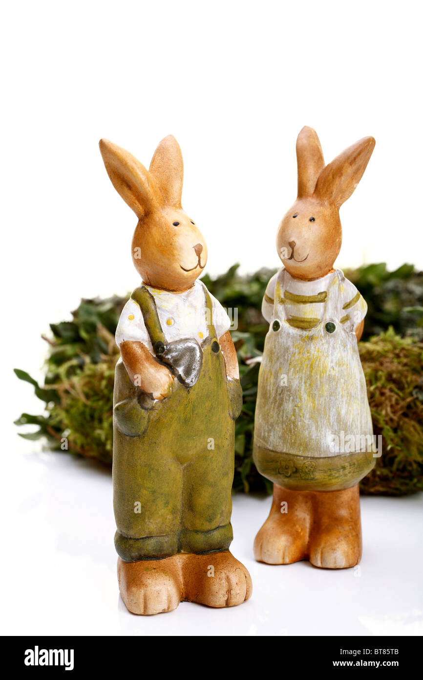 Two Easterbunnies, Easter chaplet at back Stock Photo