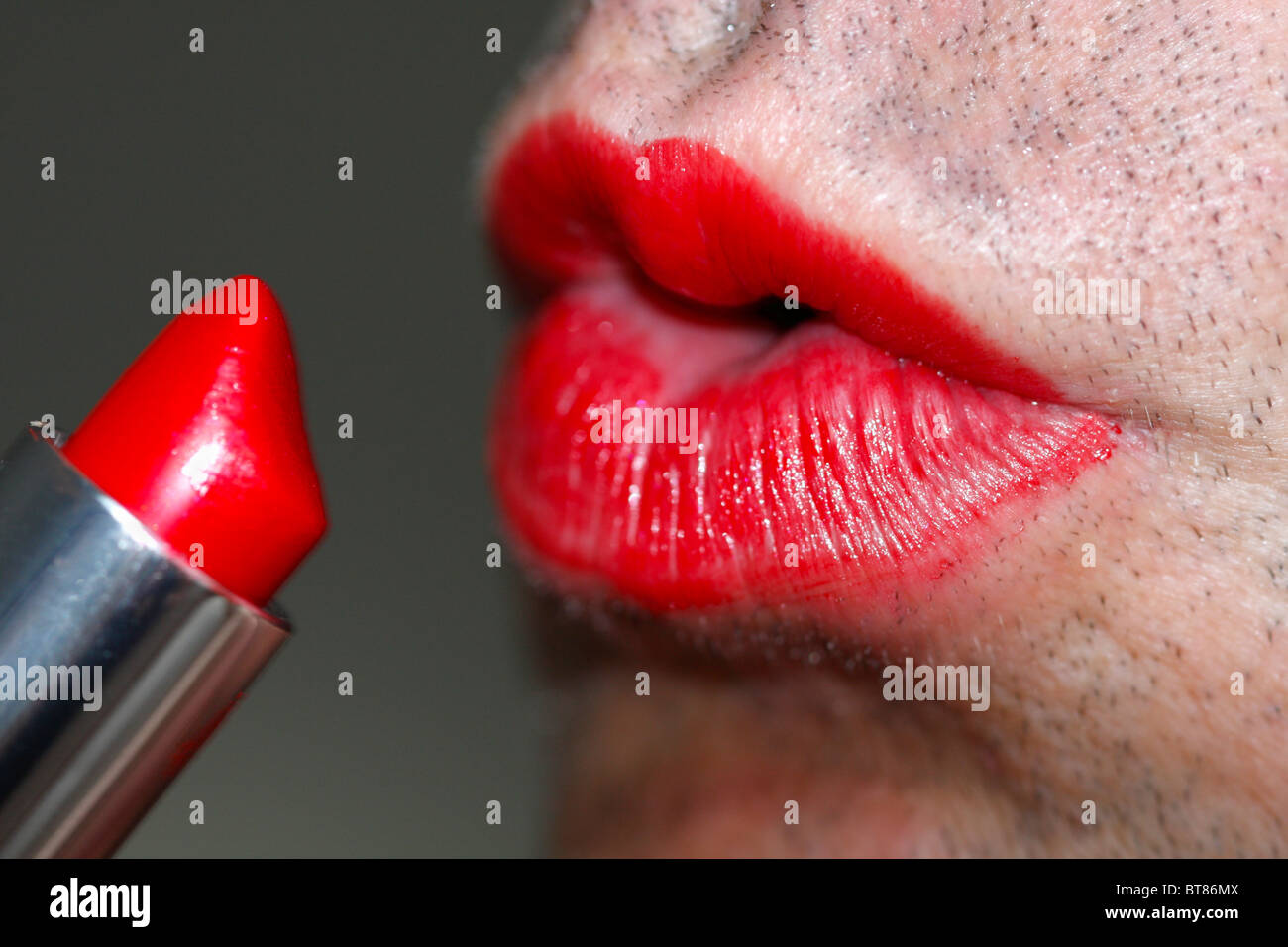 Gay felch thumb Applying lip stick for transvestite