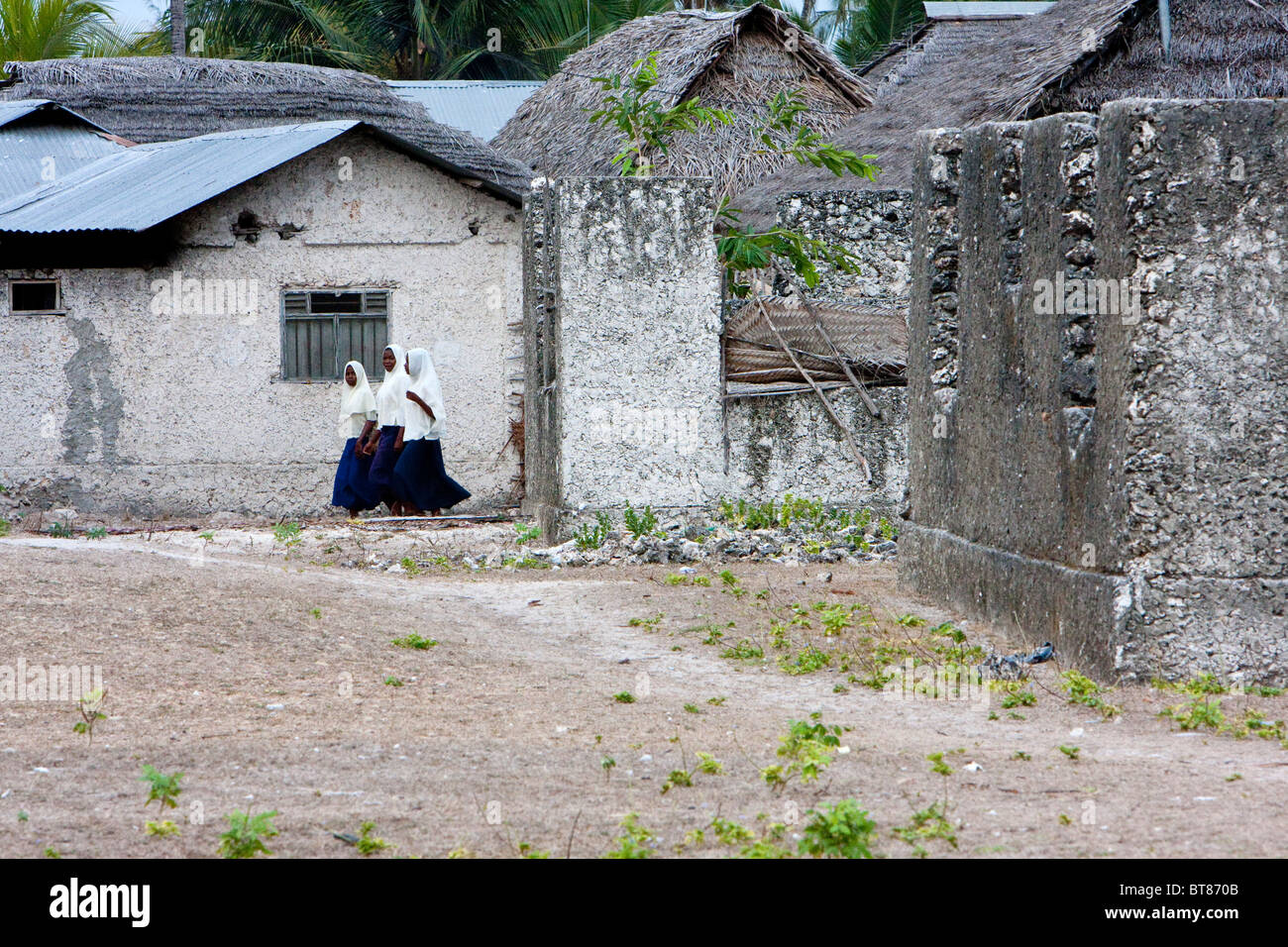 Jambiani, Zanzibar, Tanzania. Muslim Girls Going to School. Stock Photo