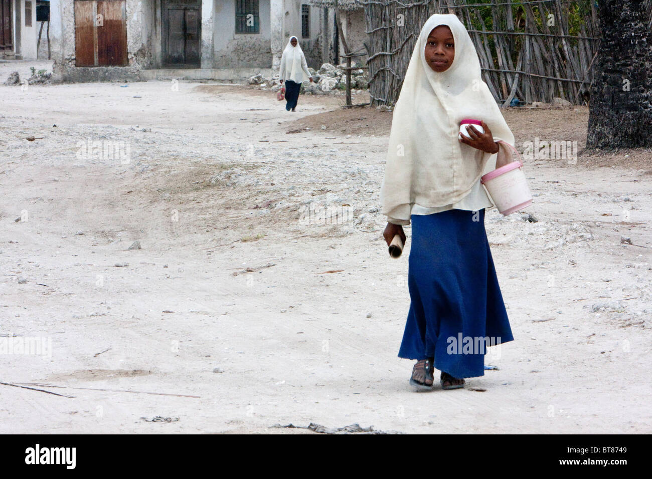 Jambiani, Zanzibar, Tanzania. Muslim Schoolgirl Walking to School. Stock Photo