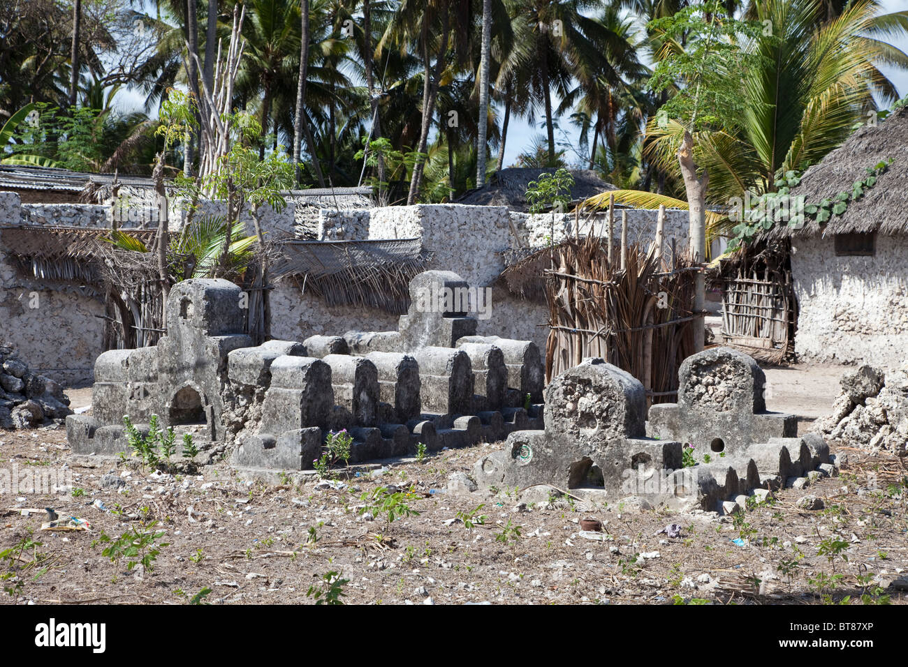 Zanzibar, Jambiani. Ancient graves. Ceramic plate embedded in front section of tomb on right. Stock Photo