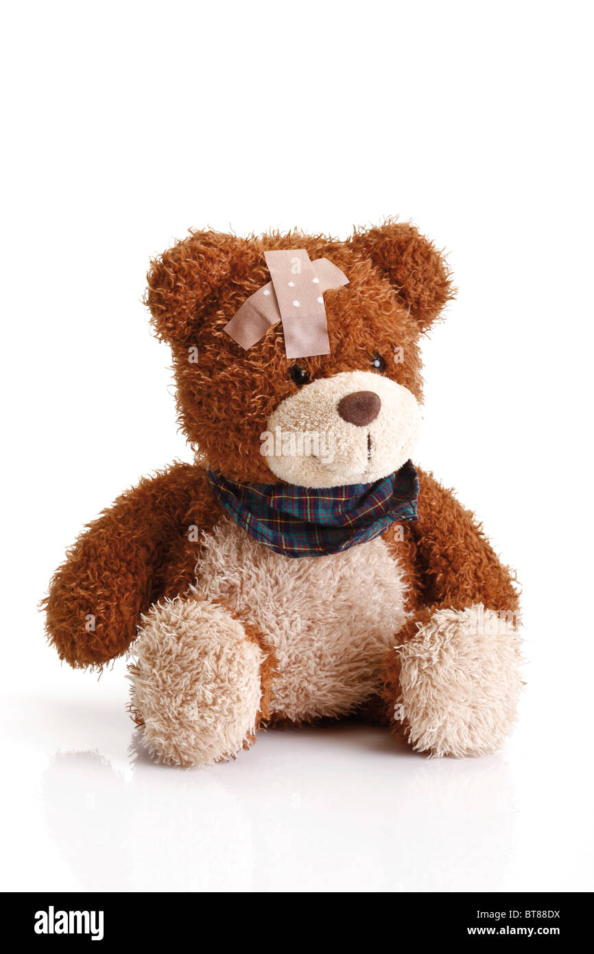 Teddy bear with a band aid on his head Stock Photo - Alamy