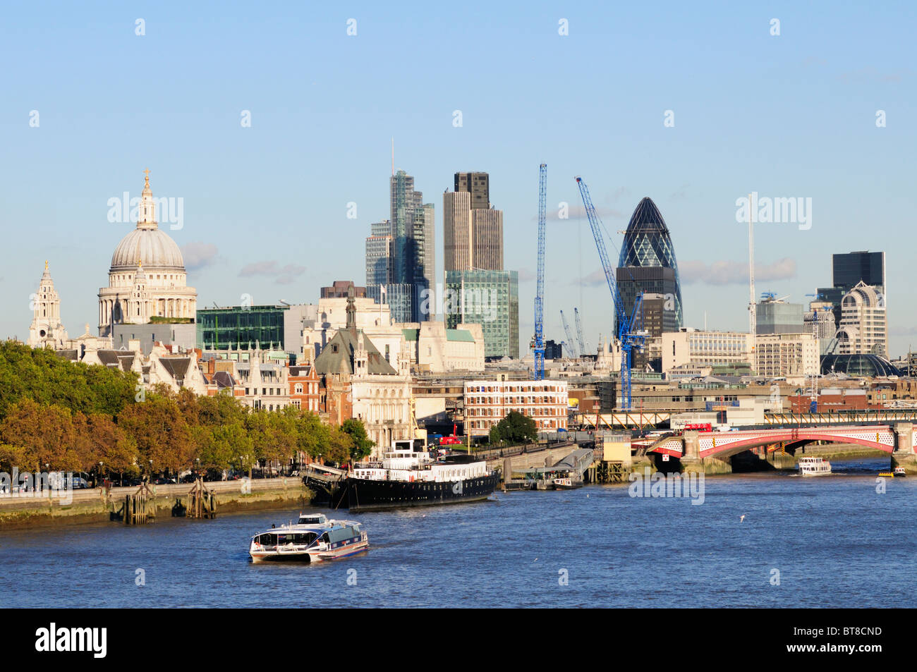 A Thames Clippers riverbus with City of London buildings, view from ...