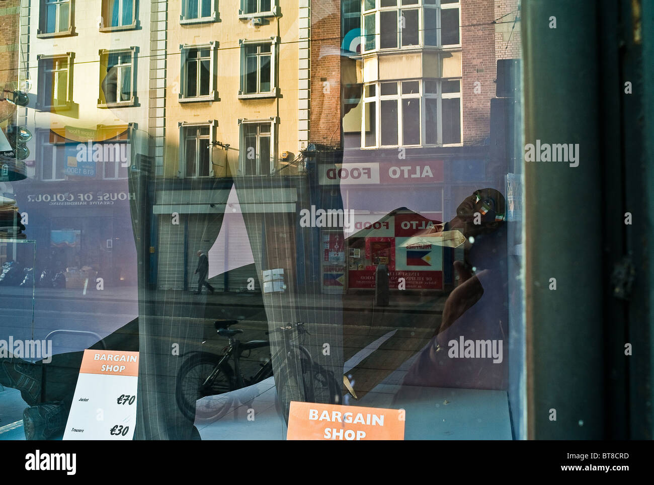 A mannequin fallen over in the window of the Bargain Shop of Arnott's