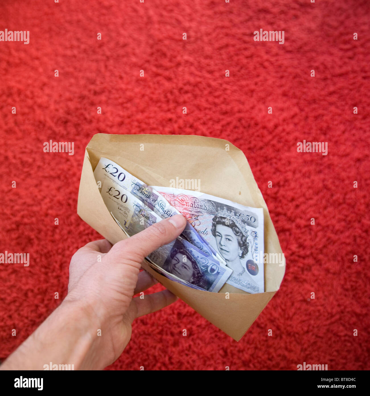 Hand , envelope with cash Stock Photo