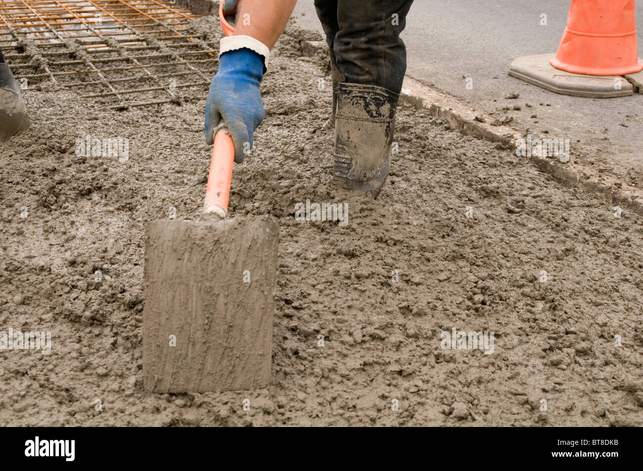 wet concrete cement work worker building construction industry pour