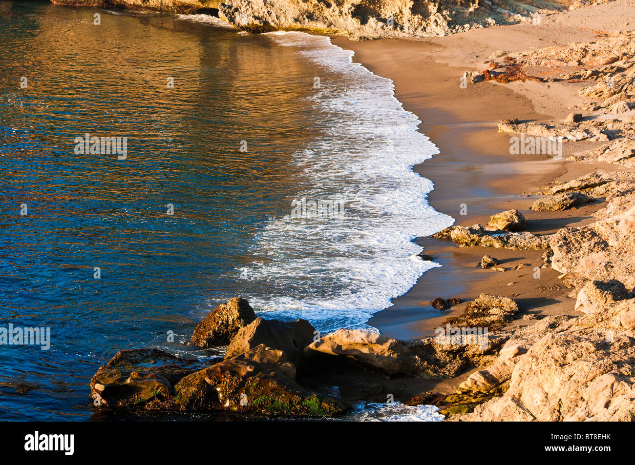 Evening light on surf at Headland Cove, Point Lobos State Reserve, Carmel, California Stock Photo