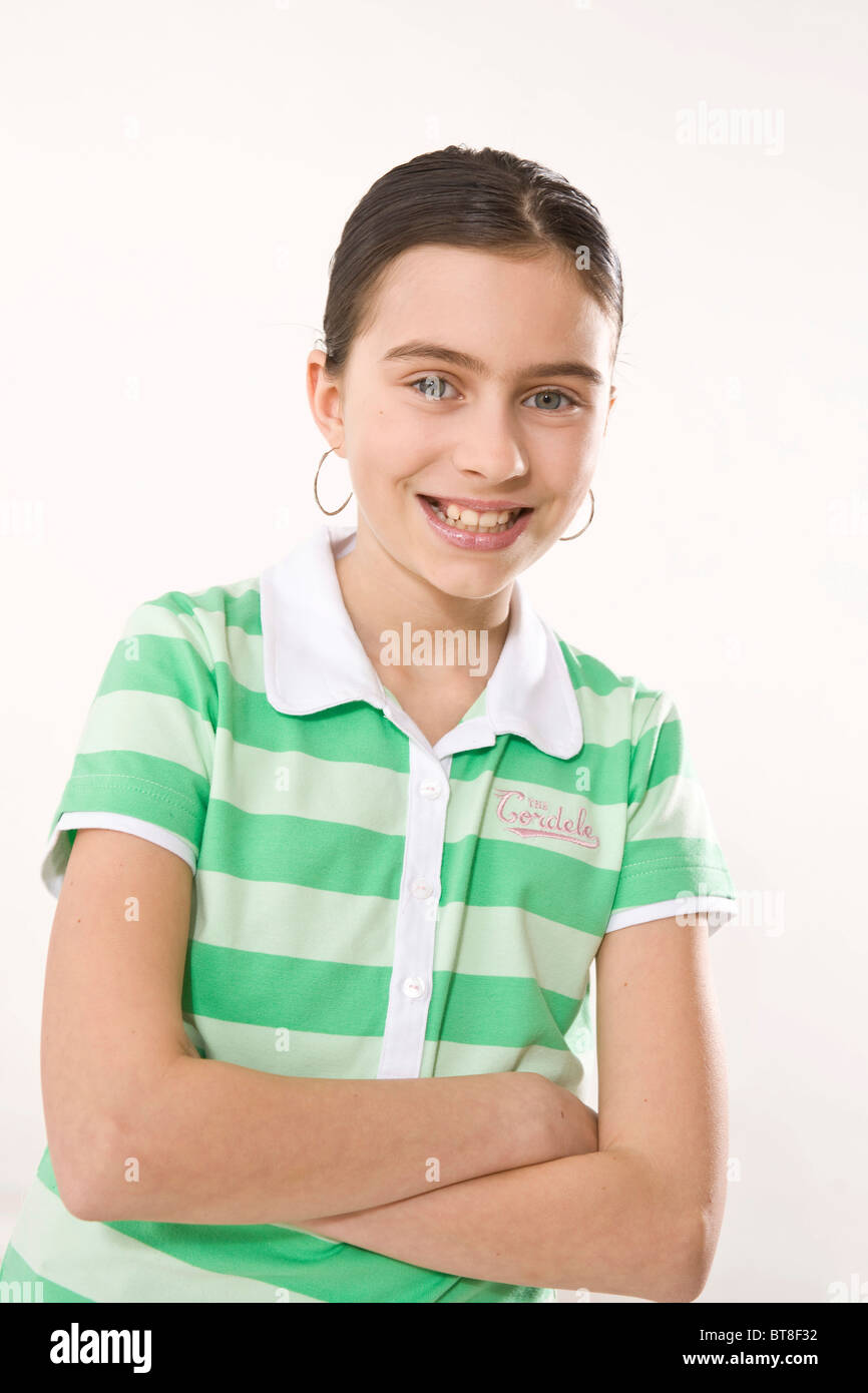 Potrait of a girl smiling with arms crossed Stock Photo - Alamy