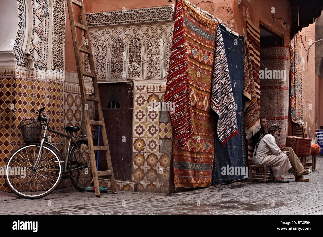 Carpet vendors sell their carpets at the medina. Morocco 2010 Stock
