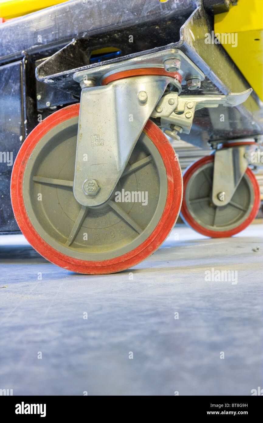 red wheels used in mobile construction platform scaffold Stock Photo