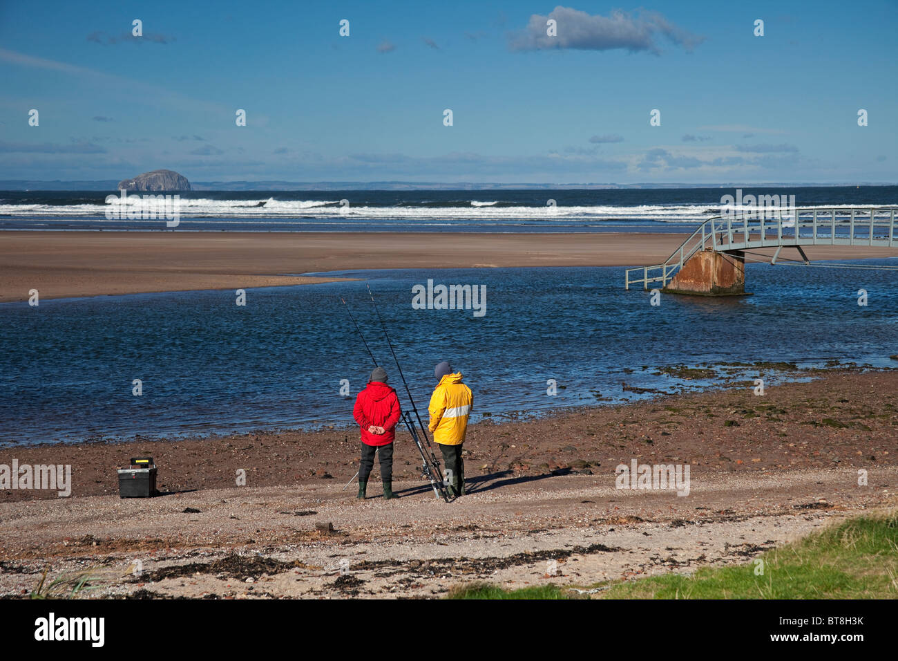 Men sea Fishing Belhaven Bay Beach, East Lothian Scotland, UK, Europe Stock Photo